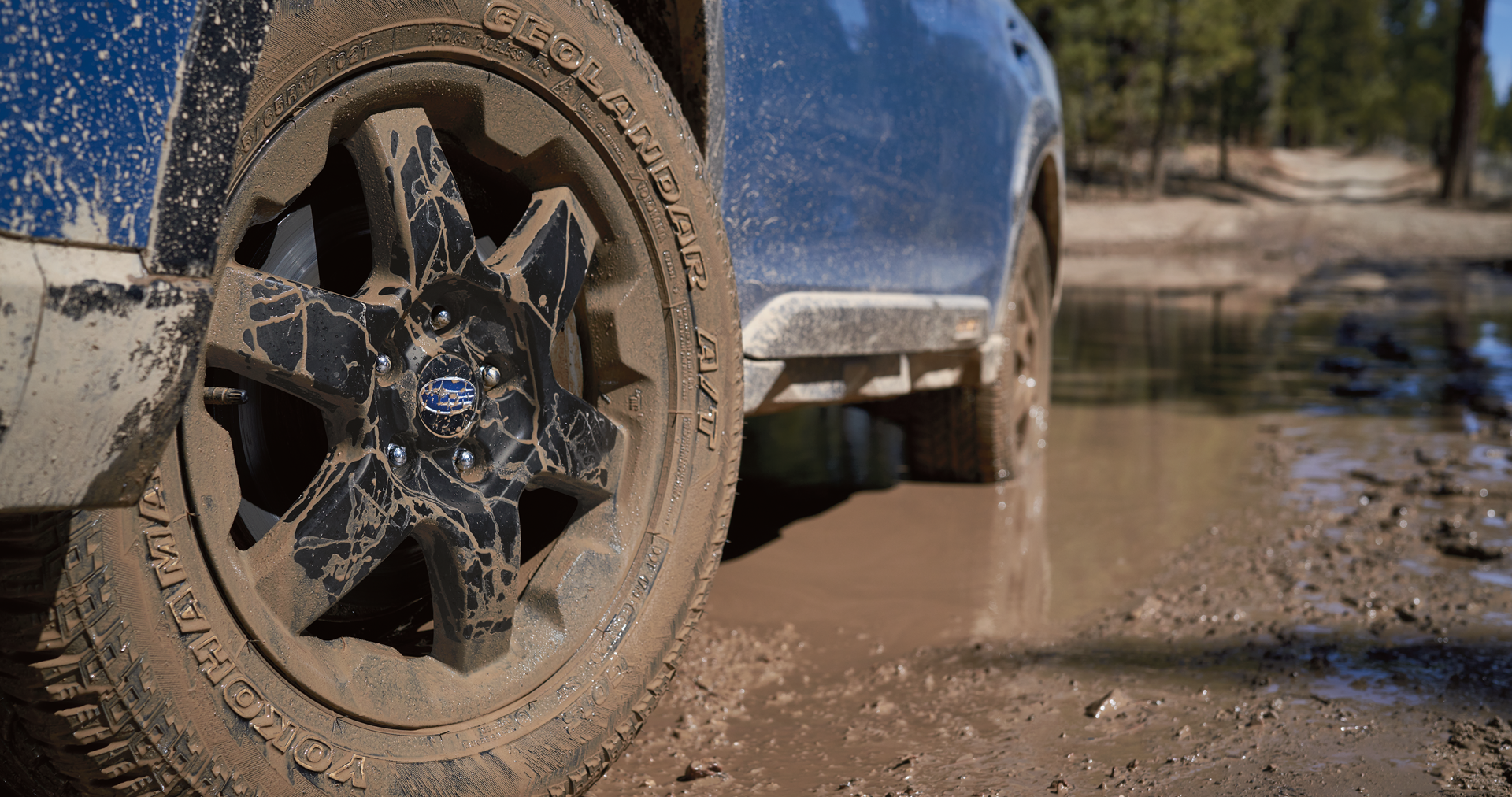 A close-up of the 17-inch off-road wheels and all-terrain Yokohama GEOLANDAR® tires on the 2023 Outback Wilderness. | Subaru Superstore of Chandler in Chandler AZ