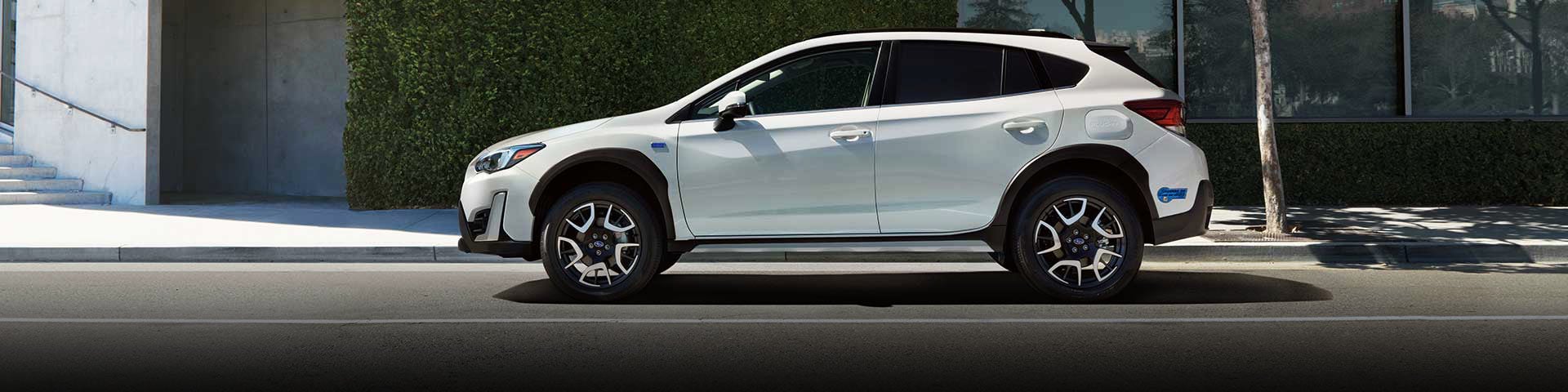 The side profile of a white Subaru Crosstrek Hybrid | Subaru Superstore of Chandler in Chandler AZ